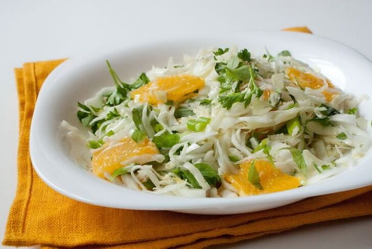 Chinese cabbage, orange and apple salad a vitamin dish with a low carbohydrate diet